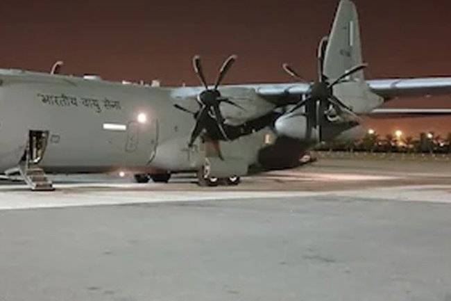 The plane carrying the bodies of forty-five Indians who were slain in Kuwait is landing in Kerala.