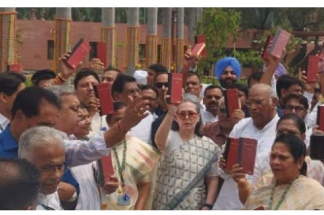 "India bloc leaders protest outside Parliament with Constitution."