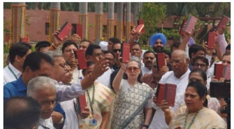 "India bloc leaders protest outside Parliament with Constitution."