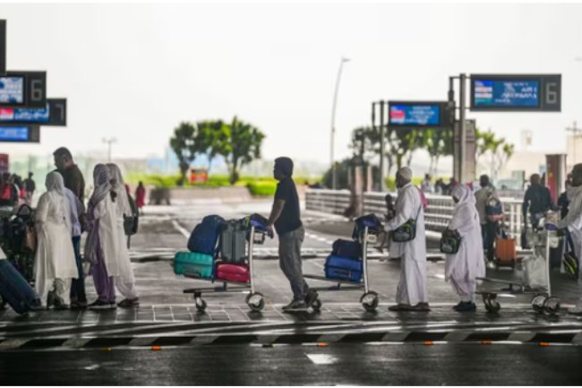 At Mumbai airport, heavy rains cause disruptions to airline operations; further rain is predicted