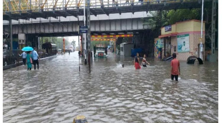 Heavy rains paralyze Mumbai; office workers endure chaos.