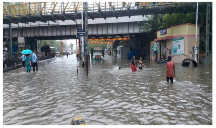 Heavy rains paralyze Mumbai; office workers endure chaos.