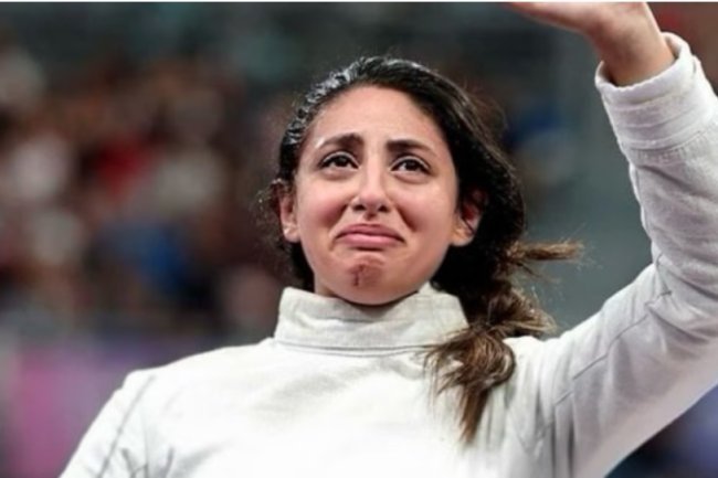 Described: How did a fencer competing in the Paris Olympics who was seven months pregnant?