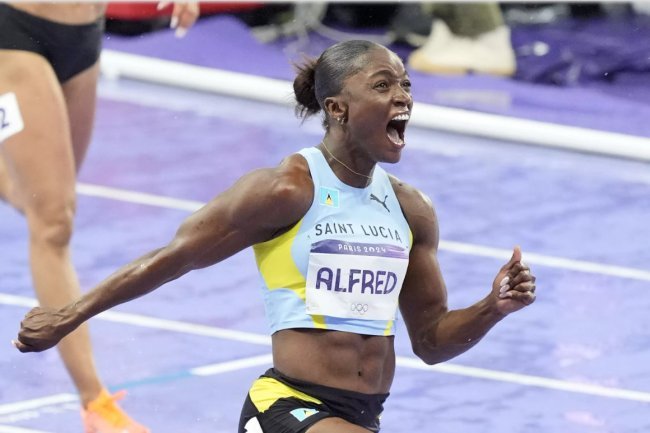 Julien Alfred earns St. Lucia's first Olympic medal in the 100 meters.