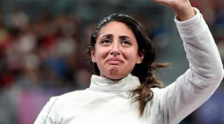 Described: How did a fencer competing in the Paris Olympics who was seven months pregnant?